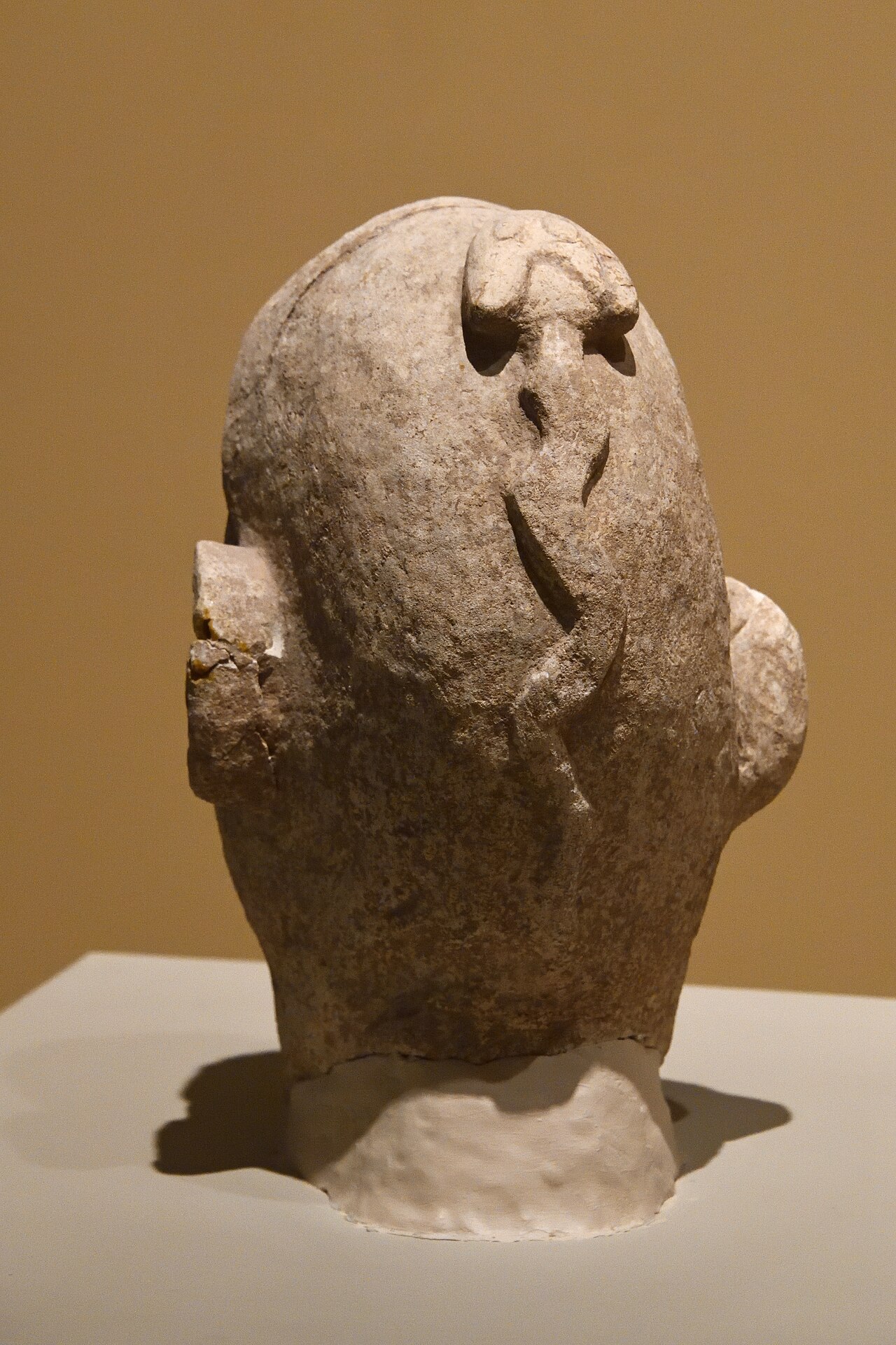 Neolithic limestone human head with a snake coiled across it, from Nevalı Çori, in the Şanlıurfa Archaeology Museum